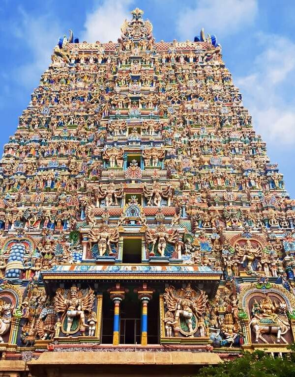 Colorful Hindu temple gopuram in Tamil Nadu with intricate carvings and traditional architecture